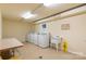 Community laundry room with modern washing machines and folding area at 1323 Queens Rd # 218, Charlotte, NC 28207