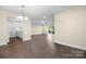Spacious living room with neutral colors and a view of the kitchen at 1323 Queens Rd # 218, Charlotte, NC 28207