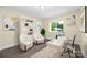 Bright home office featuring ample desk space and a comfortable seating area at 1323 Queens Rd # 218, Charlotte, NC 28207