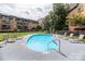 Outdoor community pool with lounge chairs and a secure perimeter fence at 1323 Queens Rd # 218, Charlotte, NC 28207