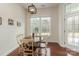 Breakfast nook with hardwood floors, a table with chairs, and natural light from the windows at 15727 Kiser Corner Ln, Davidson, NC 28036