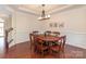 Dining room with hardwood floors, wainscoting, and a chandelier at 15727 Kiser Corner Ln, Davidson, NC 28036