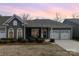 Charming single-story home with a well-manicured lawn and attached two-car garage at 15727 Kiser Corner Ln, Davidson, NC 28036