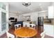 Bright open-concept kitchen featuring stainless steel appliances, island, and hardwood floors at 15727 Kiser Corner Ln, Davidson, NC 28036
