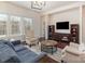 Bright living room featuring hardwood floors, a large window, and comfortable seating at 15727 Kiser Corner Ln, Davidson, NC 28036