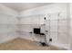Walk-in closet features wire shelving and carpeted floors at 15727 Kiser Corner Ln, Davidson, NC 28036