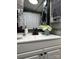 Bathroom vanity featuring white countertop, framed mirror, and modern fixtures at 158 Arrowood Trl # 27F, Mount Gilead, NC 27306