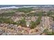 Aerial view of a neighborhood with mature trees and a community lake at 16506 Doves Canyon Ln, Charlotte, NC 28278