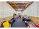 Basement with storage containers and exposed ceiling rafters at 16506 Doves Canyon Ln, Charlotte, NC 28278