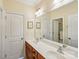 Bathroom with double sinks, large mirrors, and access to a shower at 16506 Doves Canyon Ln, Charlotte, NC 28278