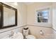 Bright bathroom features white subway tile and classic fixtures at 16506 Doves Canyon Ln, Charlotte, NC 28278