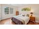 Bedroom with a large window and hardwood flooring at 16506 Doves Canyon Ln, Charlotte, NC 28278
