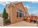 Brick home featuring a wooden deck, a brick patio and manicured landscaping at 16506 Doves Canyon Ln, Charlotte, NC 28278