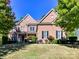 Charming two-story brick home with manicured lawn and beautiful landscaping at 16506 Doves Canyon Ln, Charlotte, NC 28278
