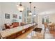 Open floorplan with large island, stainless steel sink, and living room view at 16506 Doves Canyon Ln, Charlotte, NC 28278