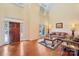 Bright living room featuring high ceilings, natural light, and hardwood floors at 16506 Doves Canyon Ln, Charlotte, NC 28278