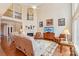 Spacious living room with fireplace, tall ceilings, wood floors and a large staircase at 16506 Doves Canyon Ln, Charlotte, NC 28278