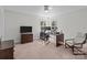 This bedroom boasts natural light, neutral walls and floors and a large desk perfect for working from home at 17215 Monocacy Blvd, Huntersville, NC 28078