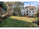 Expansive backyard with manicured lawn and a patio perfect for outdoor entertaining at 18302 Town Harbour Rd, Cornelius, NC 28031
