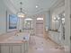 Luxurious bathroom featuring a soaking tub, a glass enclosed shower, and elegant vanity at 18302 Town Harbour Rd, Cornelius, NC 28031