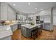 Well-designed kitchen with an island, stainless steel appliances, and custom cabinets at 18302 Town Harbour Rd, Cornelius, NC 28031