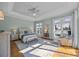 Bright main bedroom offers water views, tray ceilings, and an elegant sitting area at 18302 Town Harbour Rd, Cornelius, NC 28031
