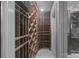 Walk-in wine cellar with extensive custom wood racking to showcase an ample collection of wines at 18302 Town Harbour Rd, Cornelius, NC 28031