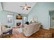 Cozy living room with a fireplace, hardwood floors, and plenty of natural light at 2031 Covered Bridge Ct, Rock Hill, SC 29732