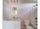 Bathroom showcasing vanity with marble countertop, matching framed mirror and fixtures at 240 Mark Ryan Ln, Dallas, NC 28034