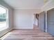 Neutral bedroom featuring hardwood floors and view to the stairs at 240 Mark Ryan Ln, Dallas, NC 28034