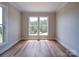 Bedroom with natural light featuring light walls and views of nature at 240 Mark Ryan Ln, Dallas, NC 28034