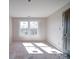 Bright bedroom with two windows for natural light showing unfinished floors provides a serene and customizable space at 240 Mark Ryan Ln, Dallas, NC 28034