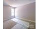 Bedroom features carpet, base trim, and a window providing plenty of natural light at 240 Mark Ryan Ln, Dallas, NC 28034