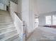 Bright and airy interior showcasing the staircase and walls at 240 Mark Ryan Ln, Dallas, NC 28034