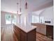 Spacious kitchen with dual islands, stainless steel appliances, and views to the living room at 240 Mark Ryan Ln, Dallas, NC 28034