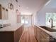 Modern kitchen features an island, sink and stainless steel appliances at 240 Mark Ryan Ln, Dallas, NC 28034