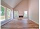 Bright living room featuring hardwood floors, large windows and a fireplace at 240 Mark Ryan Ln, Dallas, NC 28034