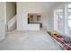 Large living room with opening into the kitchen, lots of natural light, and stairs to the second floor at 240 Mark Ryan Ln, Dallas, NC 28034