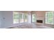 Bright living room featuring hardwood floors, large windows with views and a fireplace at 240 Mark Ryan Ln, Dallas, NC 28034