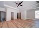 Spacious main bedroom features wood floor, tray ceiling, a ceiling fan and great views at 240 Mark Ryan Ln, Dallas, NC 28034