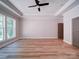 Spacious main bedroom features wood floor, tray ceiling, and a ceiling fan providing comfort at 240 Mark Ryan Ln, Dallas, NC 28034
