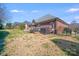 A backyard view of the deck and brick exterior at 2813 Monterrey Ln, Monroe, NC 28110