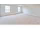 Bright, spacious bedroom with large windows and carpet at 3064 Virginia Trail Ct, Fort Mill, SC 29715