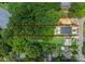 Aerial view highlighting property lines, providing a glimpse of the homesite and surroundings in a leafy neighborhood at 3627 Rogers St, Charlotte, NC 28208