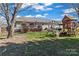 Large backyard featuring a deck, playground, and a spacious grassy area at 3757 Fieldhaven Ct, Maiden, NC 28650