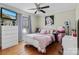 Inviting bedroom with a ceiling fan, wood floors, and a stylish desk area at 3757 Fieldhaven Ct, Maiden, NC 28650