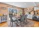 Bright dining area with modern furnishings, hardwood floors, and natural light at 3757 Fieldhaven Ct, Maiden, NC 28650