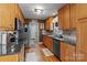 Well-equipped kitchen with stainless steel appliances, granite countertops, and ample cabinet space at 3757 Fieldhaven Ct, Maiden, NC 28650