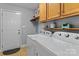 Convenient laundry room with washer, dryer, and ample storage space at 3757 Fieldhaven Ct, Maiden, NC 28650