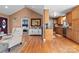 Inviting living room with vaulted ceilings, wood floors, and a view to the bedroom at 3757 Fieldhaven Ct, Maiden, NC 28650
